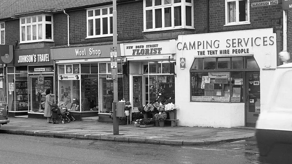 In this image is a parade of four shops that once served communities on Narborough road.